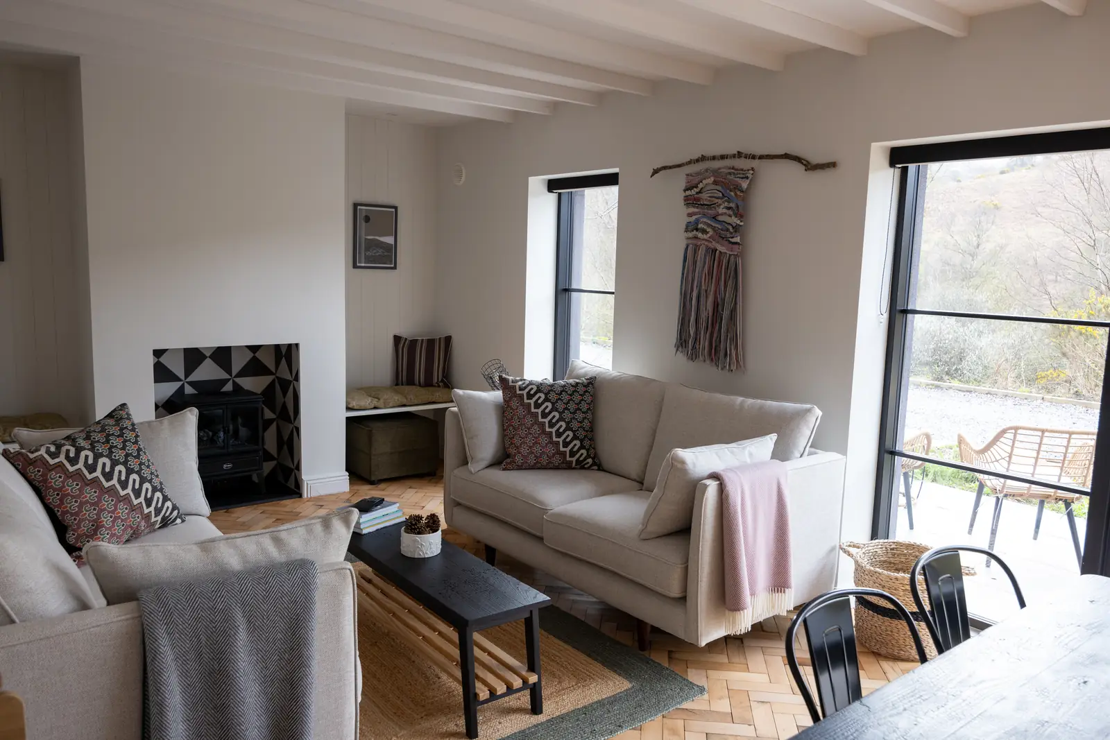 Cottage lounge with sofas and wood burner