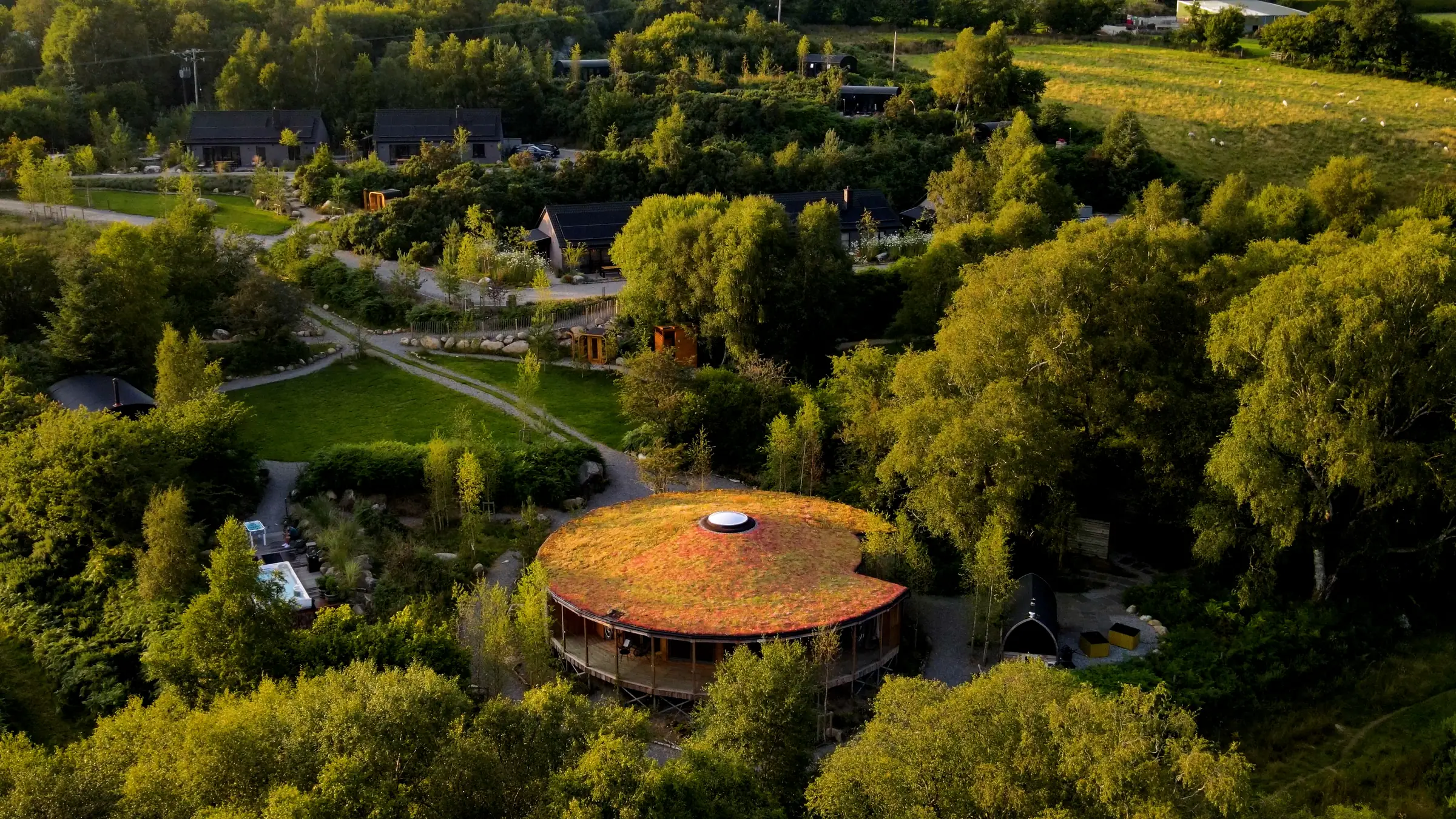 The Deerstone and its roundhouse from above, held by the Wicklow hills